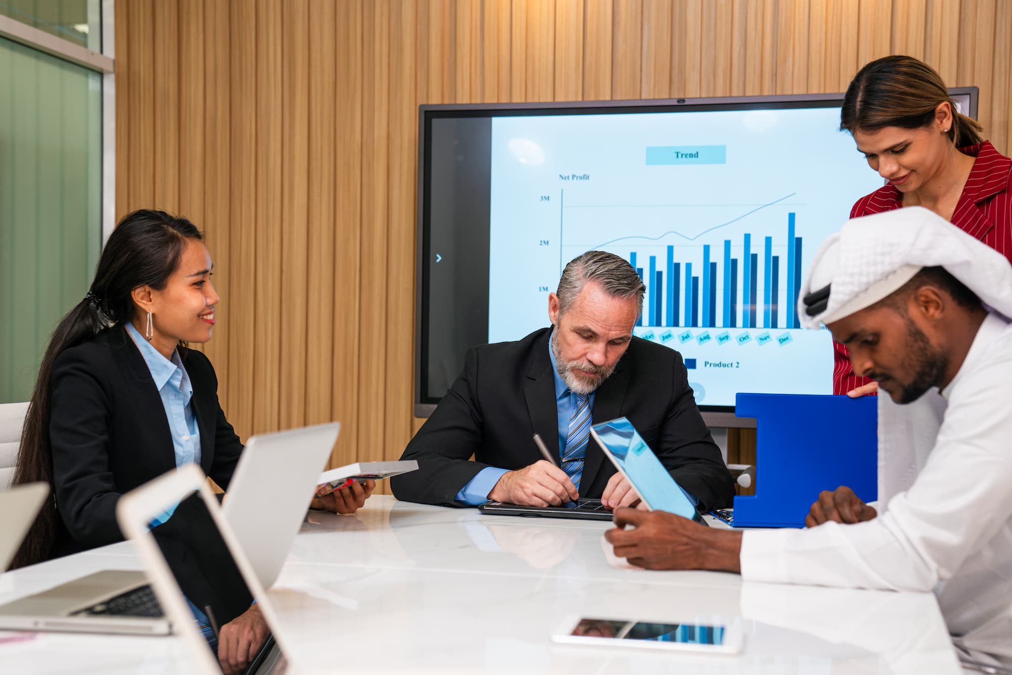 Advisor reviewing performance charts in a meeting room